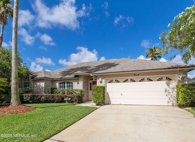4458 Deep River Way E, Jacksonville, FL 32224 - ranch-style home featuring a garage, concrete driveway, a front lawn, and brick siding