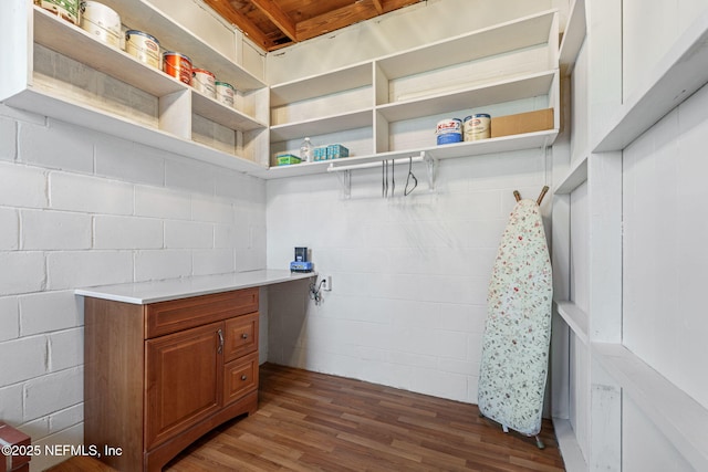 3130 Honeywood Dr, Jacksonville, FL 32277 - bathroom featuring concrete block wall and wood finished floors