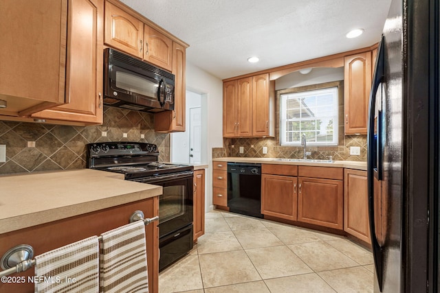 3130 Honeywood Dr, Jacksonville, FL 32277 - kitchen featuring black appliances, a sink, light tile patterned flooring, decorative backsplash, and recessed lighting