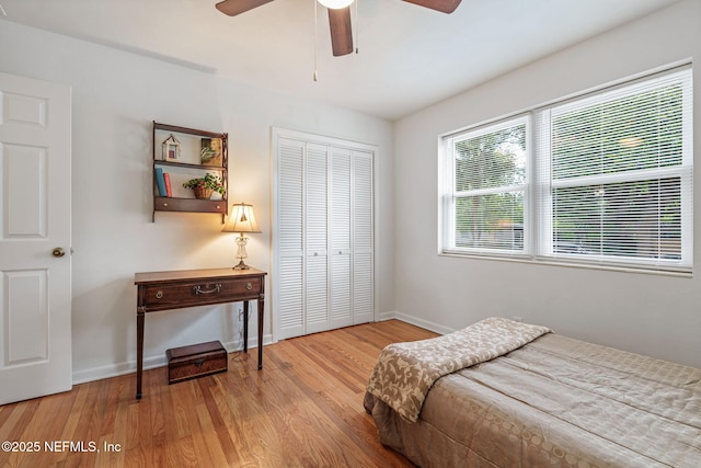 3130 Honeywood Dr, Jacksonville, FL 32277 - bedroom featuring a closet, wood finished floors, baseboards, and a ceiling fan