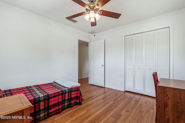 3130 Honeywood Dr, Jacksonville, FL 32277 - bedroom with light wood finished floors, a closet, baseboards, and ceiling fan