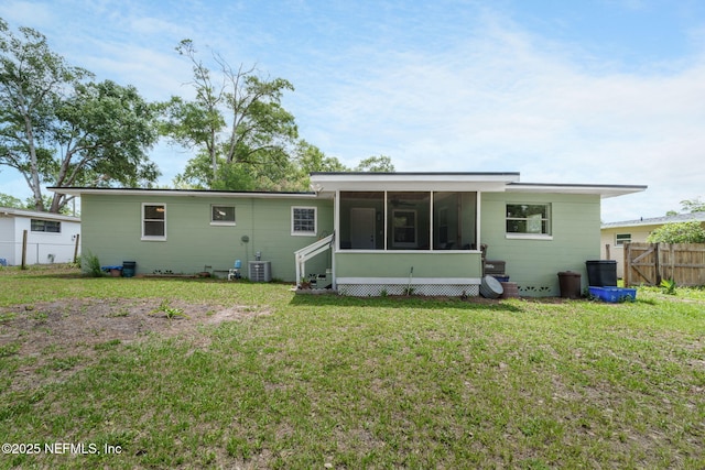 3130 Honeywood Dr, Jacksonville, FL 32277 - back of house featuring a sunroom and cooling unit