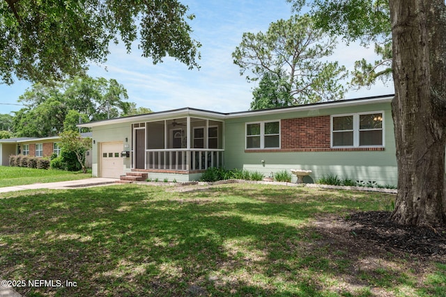 3130 Honeywood Dr, Jacksonville, FL 32277 - ranch-style home with a garage, a front lawn, ceiling fan, driveway, and a porch