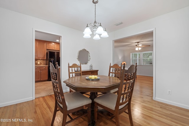 3130 Honeywood Dr, Jacksonville, FL 32277 - dining space with a chandelier, light wood-type flooring, baseboards, and ceiling fan