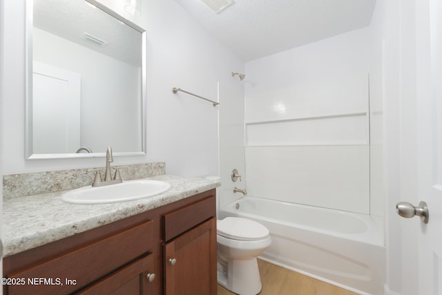 7127 Stetson St, Keystone Heights, FL 32656 - bathroom with vanity, toilet,  shower combination, and wood finished floors