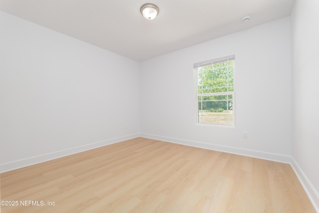 7127 Stetson St, Keystone Heights, FL 32656 - empty room with light wood-style floors, baseboards, and a smoke detector