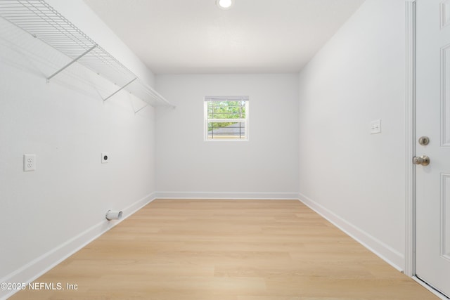 7127 Stetson St, Keystone Heights, FL 32656 - laundry room with hookup for an electric dryer, light wood-style flooring, baseboards, and recessed lighting