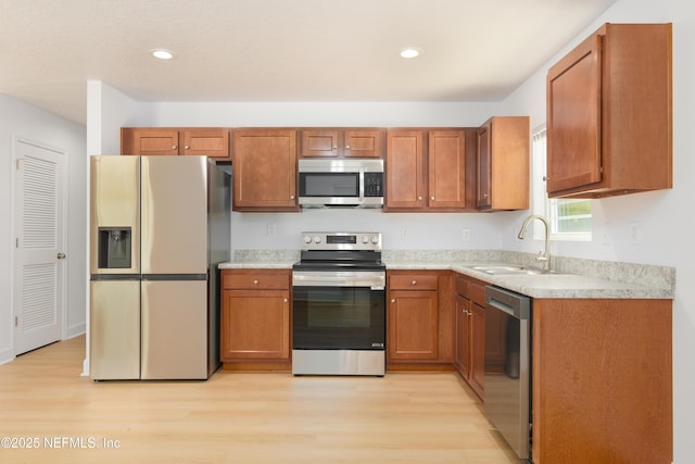 7127 Stetson St, Keystone Heights, FL 32656 - kitchen featuring stainless steel appliances, light wood finished floors, light countertops, a sink, and recessed lighting
