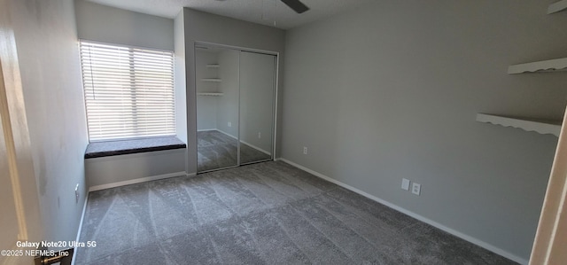 7640 Las Palmas Way Unit 149, Jacksonville, FL 32256 - unfurnished bedroom featuring carpet, baseboards, a closet, and ceiling fan