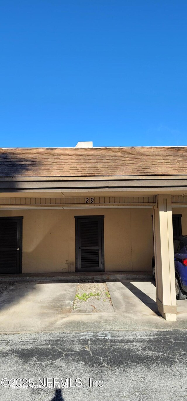 7640 Las Palmas Way Unit 149, Jacksonville, FL 32256 - property entrance featuring roof with shingles