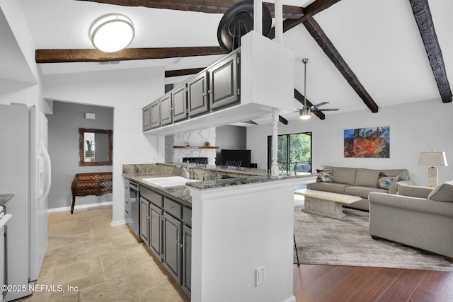 721 Sandy Oaks Ct, Ponte Vedra Beach, FL 32082 - kitchen featuring freestanding refrigerator, beamed ceiling, dishwasher, ceiling fan, and a high end fireplace