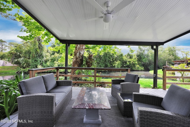 721 Sandy Oaks Ct, Ponte Vedra Beach, FL 32082 - view of patio / terrace featuring an outdoor living space, a ceiling fan, a deck with water view, and view of scattered trees