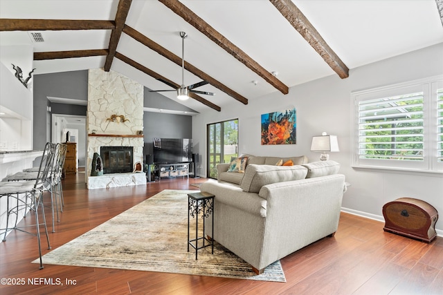 721 Sandy Oaks Ct, Ponte Vedra Beach, FL 32082 - living room with a ceiling fan, beamed ceiling, baseboards, a fireplace, and wood finished floors