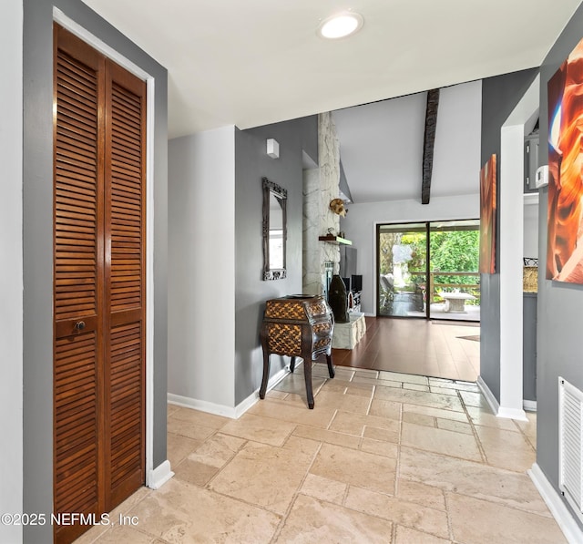 721 Sandy Oaks Ct, Ponte Vedra Beach, FL 32082 - corridor featuring stone tile floors, baseboards, lofted ceiling, and recessed lighting