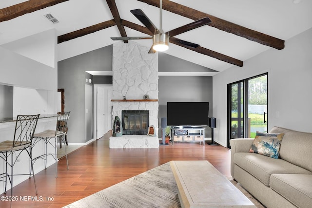 721 Sandy Oaks Ct, Ponte Vedra Beach, FL 32082 - living area featuring a ceiling fan, wood finished floors, beam ceiling, a fireplace, and baseboards
