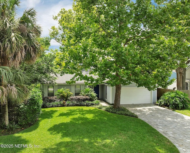 721 Sandy Oaks Ct, Ponte Vedra Beach, FL 32082 - view of property hidden behind natural elements featuring driveway, a garage, and a front yard
