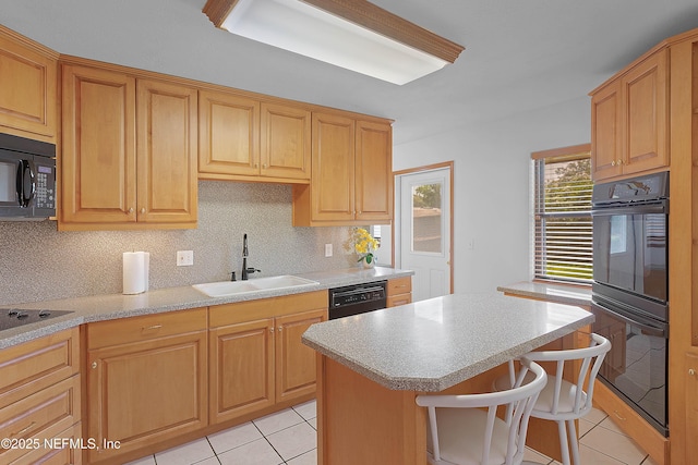 3344 Queen Ann Ln, Jacksonville, FL 32257 - kitchen featuring black appliances, light tile patterned floors, and light countertops