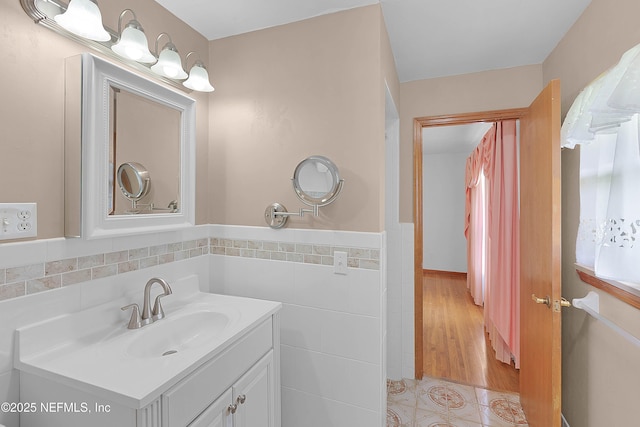 3344 Queen Ann Ln, Jacksonville, FL 32257 - bathroom with tile walls, vanity, a wainscoted wall, and tile patterned flooring