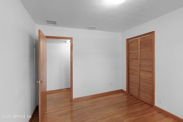 3344 Queen Ann Ln, Jacksonville, FL 32257 - unfurnished bedroom with a closet and wood finished floors