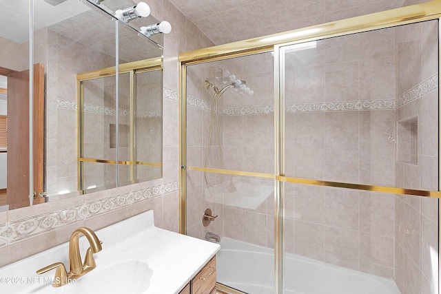 3344 Queen Ann Ln, Jacksonville, FL 32257 - full bathroom featuring vanity, shower / bath combination with glass door, and tile walls