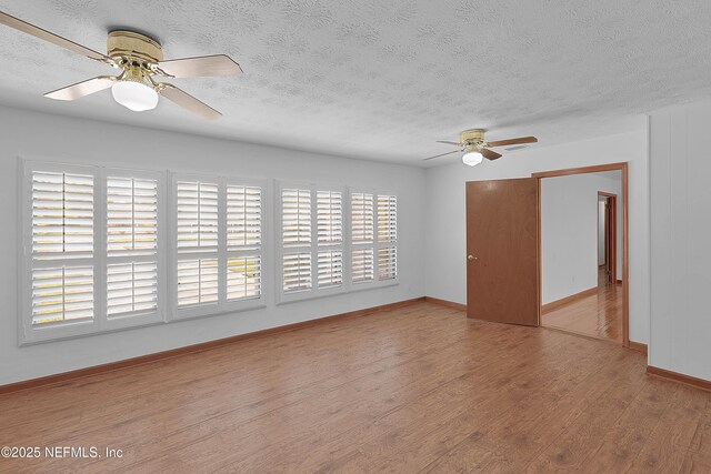 3344 Queen Ann Ln, Jacksonville, FL 32257 - spare room with ceiling fan, a textured ceiling, and wood finished floors