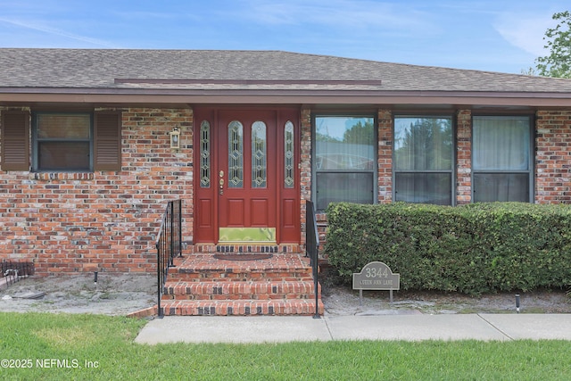 3344 Queen Ann Ln, Jacksonville, FL 32257 - doorway to property featuring brick siding and roof with shingles