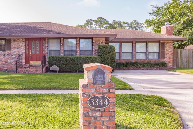 3344 Queen Ann Ln, Jacksonville, FL 32257 - ranch-style home featuring brick siding, a chimney, and a shingled roof