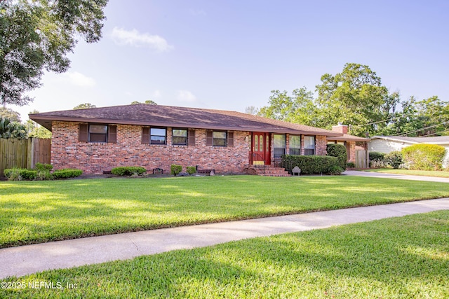3344 Queen Ann Ln, Jacksonville, FL 32257 - ranch-style house featuring brick siding, a chimney, and driveway