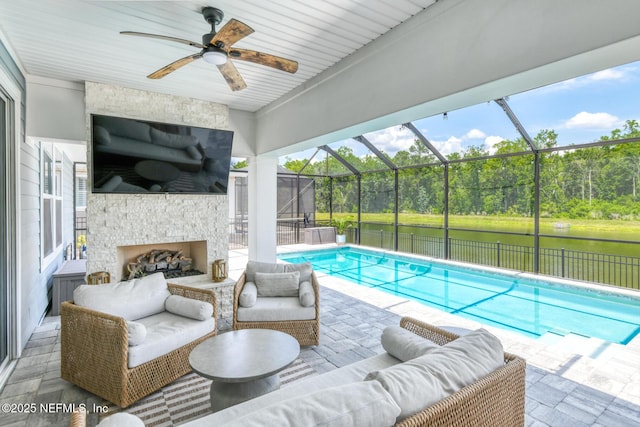 843 Windley Dr, Saint Augustine, FL 32092 - view of swimming pool with an outdoor living space with a fireplace, a patio, a water view, and a ceiling fan