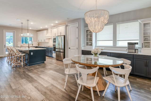 843 Windley Dr, Saint Augustine, FL 32092 - dining area featuring a chandelier, recessed lighting, and wood finished floors
