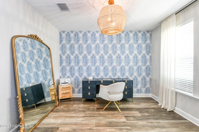 843 Windley Dr, Saint Augustine, FL 32092 - home office featuring wallpapered walls, an accent wall, baseboards, wood finished floors, and a chandelier