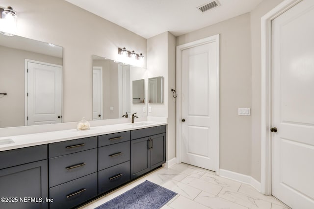 843 Windley Dr, Saint Augustine, FL 32092 - full bath with double vanity, marble look tile flooring, and baseboards