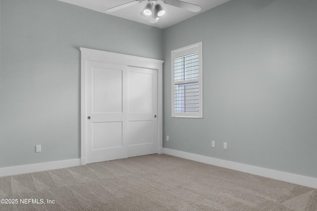 11 Woodstone Ln, Palm Coast, FL 32164 - unfurnished bedroom featuring carpet, baseboards, and ceiling fan