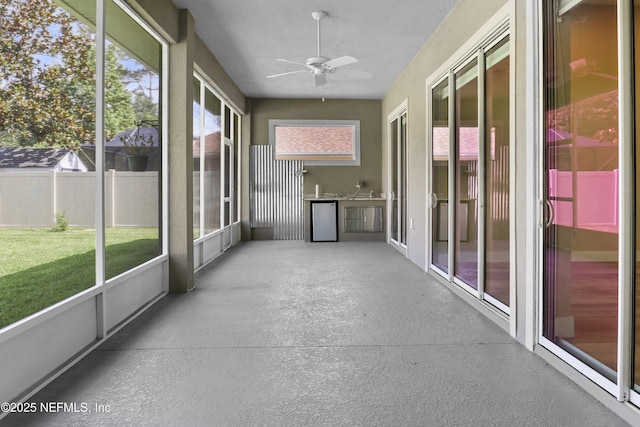 11 Woodstone Ln, Palm Coast, FL 32164 - unfurnished sunroom with a ceiling fan