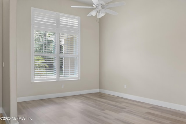 11 Woodstone Ln, Palm Coast, FL 32164 - empty room featuring healthy amount of natural light, wood finished floors, baseboards, and a ceiling fan