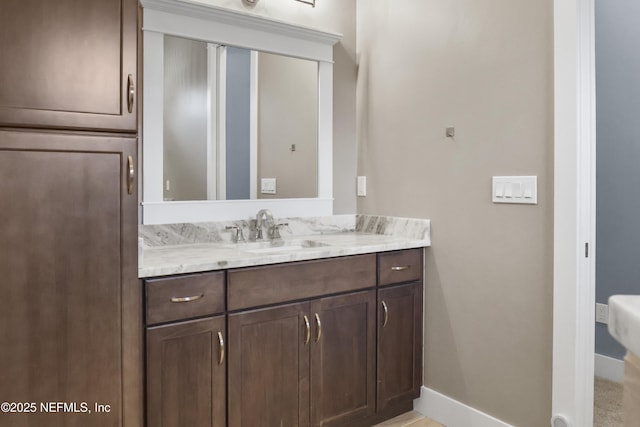 11 Woodstone Ln, Palm Coast, FL 32164 - bathroom featuring vanity and baseboards