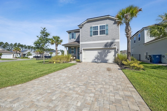 70 Creekmore Dr, Saint Augustine, FL 32092 - view of front of home featuring decorative driveway, an attached garage, and a front lawn