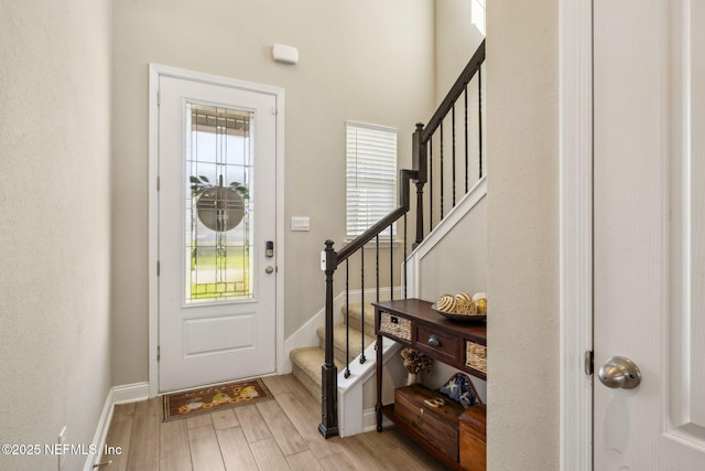 70 Creekmore Dr, Saint Augustine, FL 32092 - foyer featuring light wood-style floors and stairs