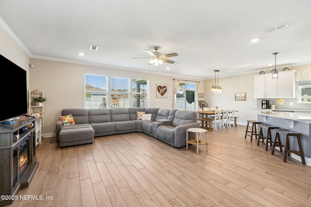 70 Creekmore Dr, Saint Augustine, FL 32092 - living area with ornamental molding, light wood finished floors, ceiling fan, and recessed lighting