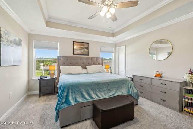 70 Creekmore Dr, Saint Augustine, FL 32092 - bedroom with light carpet, multiple windows, a tray ceiling, ornamental molding, and ceiling fan