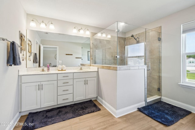 70 Creekmore Dr, Saint Augustine, FL 32092 - bathroom with double vanity, wood finished floors, and a stall shower