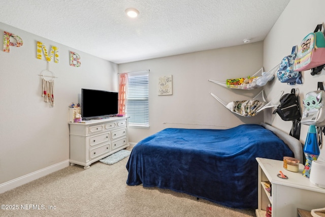 70 Creekmore Dr, Saint Augustine, FL 32092 - bedroom featuring a textured ceiling and light colored carpet