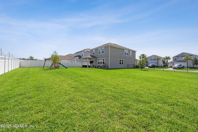 70 Creekmore Dr, Saint Augustine, FL 32092 - fenced backyard featuring a playground and a residential view