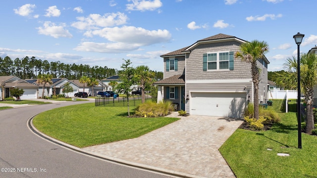 70 Creekmore Dr, Saint Augustine, FL 32092 - view of front of property with decorative driveway and a garage