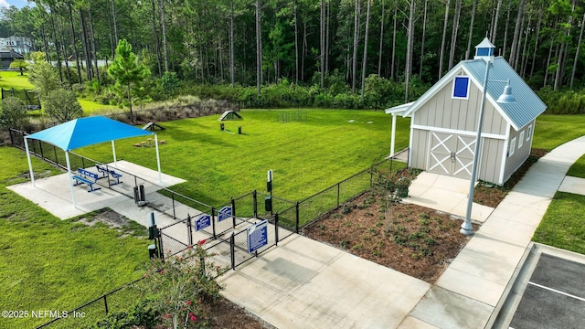 70 Creekmore Dr, Saint Augustine, FL 32092 - view of home's community featuring a gate, an outdoor structure, and a barn