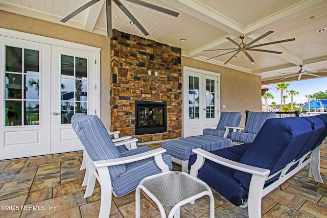 70 Creekmore Dr, Saint Augustine, FL 32092 - view of patio with french doors, ceiling fan, and an outdoor living space with a fireplace