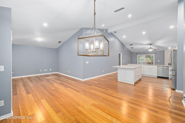 2007 Hollington Dr, Jacksonville, FL 32246 - unfurnished living room featuring light wood-style floors, a chandelier, a ceiling fan, and baseboards