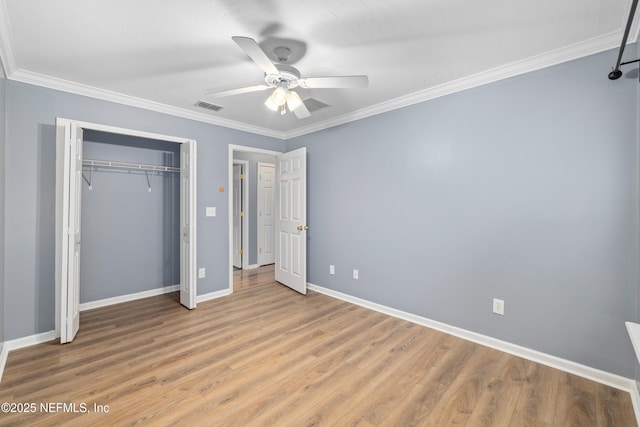 2007 Hollington Dr, Jacksonville, FL 32246 - unfurnished bedroom featuring crown molding, baseboards, light wood-style floors, a closet, and ceiling fan
