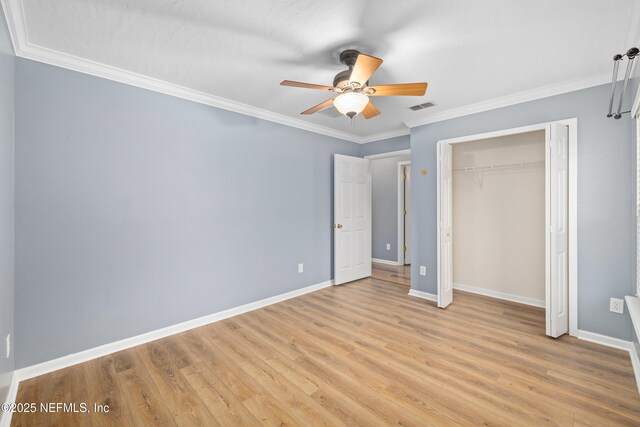 2007 Hollington Dr, Jacksonville, FL 32246 - unfurnished bedroom featuring baseboards, light wood-style flooring, crown molding, a closet, and a ceiling fan