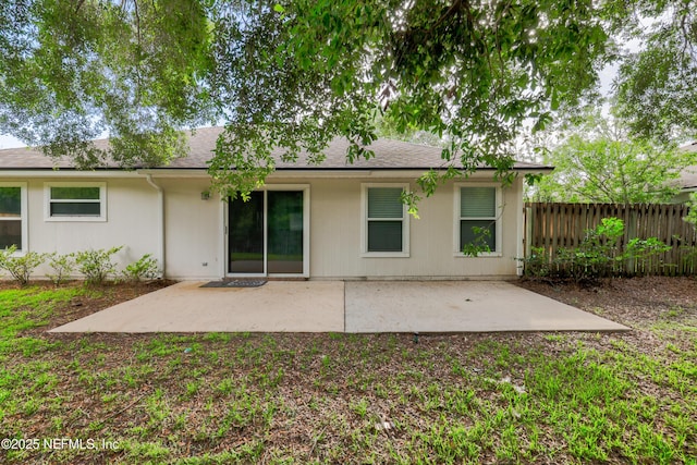 2007 Hollington Dr, Jacksonville, FL 32246 - rear view of house featuring a patio area and a shingled roof